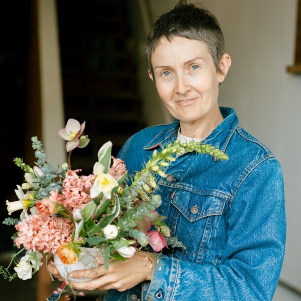 kelly brown with do right flower farm holding a bouqyet they made