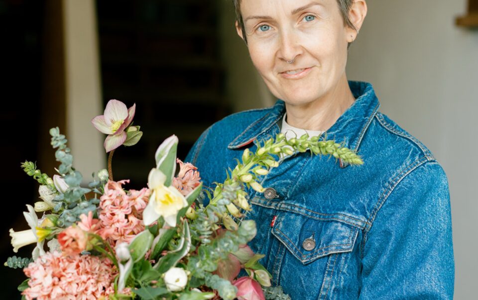 kelly brown with do right flower farm holding a bouqyet they made
