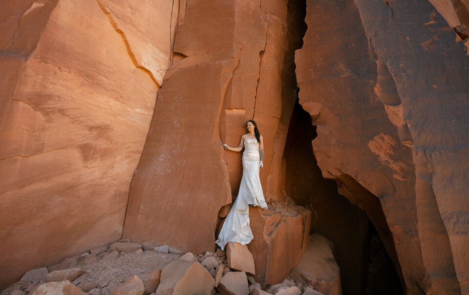 Woman Climbing in utah in a wedding dress